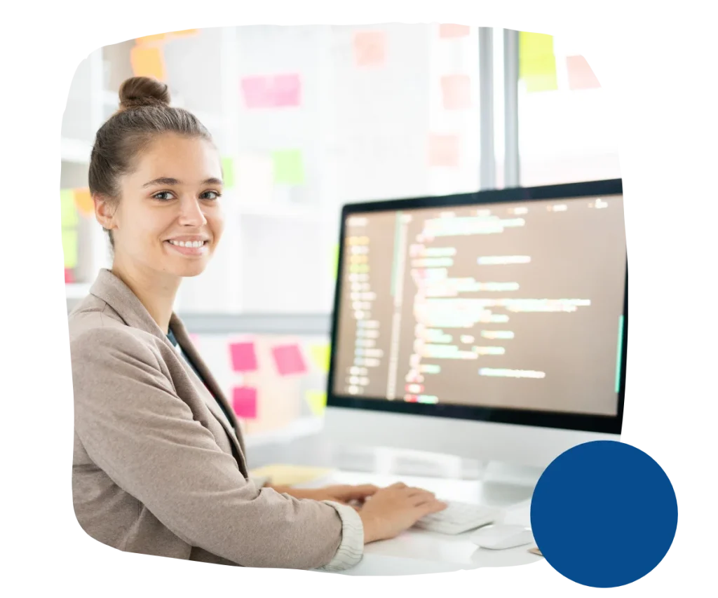 Happy woman in front of a computer