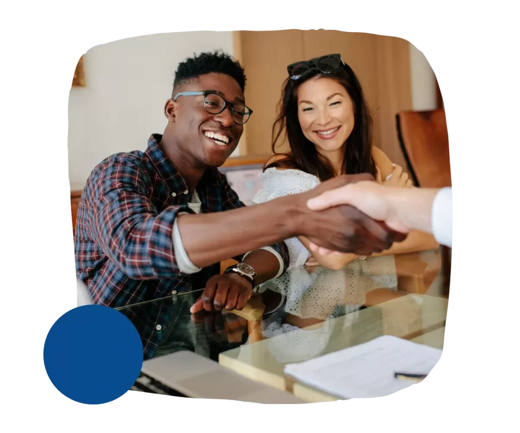 Man and woman, shaking hands with another person